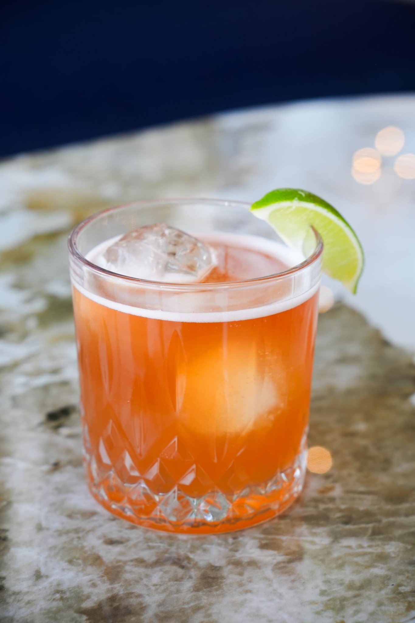 Amber cocktail with lime